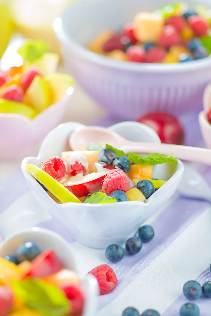 Red Strawberries and Berries on a White Surface, Candid Moment – Culinary Photography